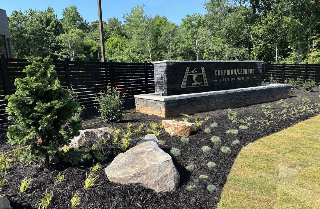 Corporate monument sign set in boulders and new plantings