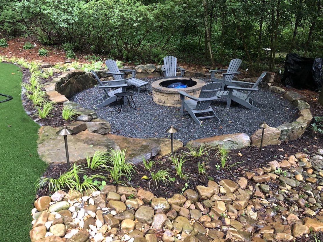 Dry creek wrapping a slate fire-pit terrace