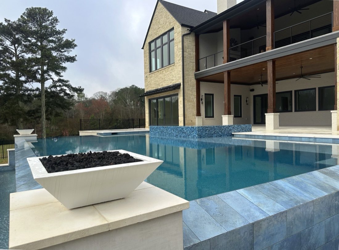 Infinity-edge pool with fire bowl