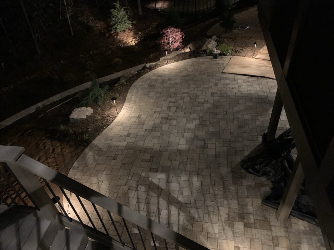 Paver patio washed in low-voltage light