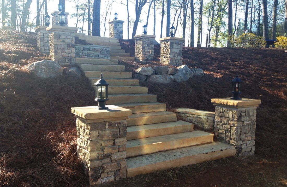 Stone staircase with lantern pillars climbing the hillside