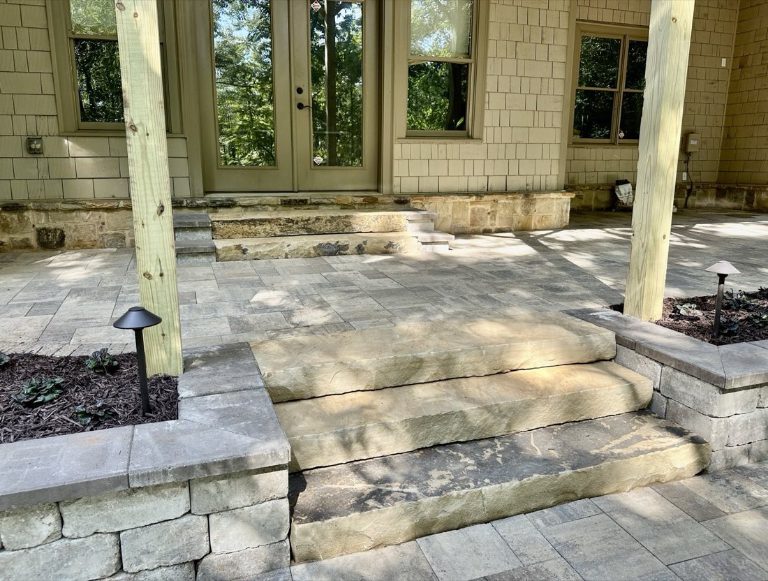 Stone steps and landing at a covered porch
