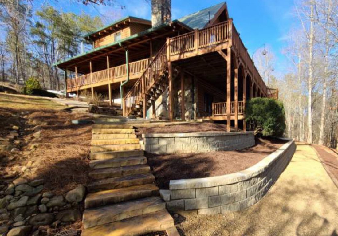 Terraced block walls and stone steps on a steep grade